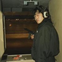 Viktor Tsoi holding submachine gun